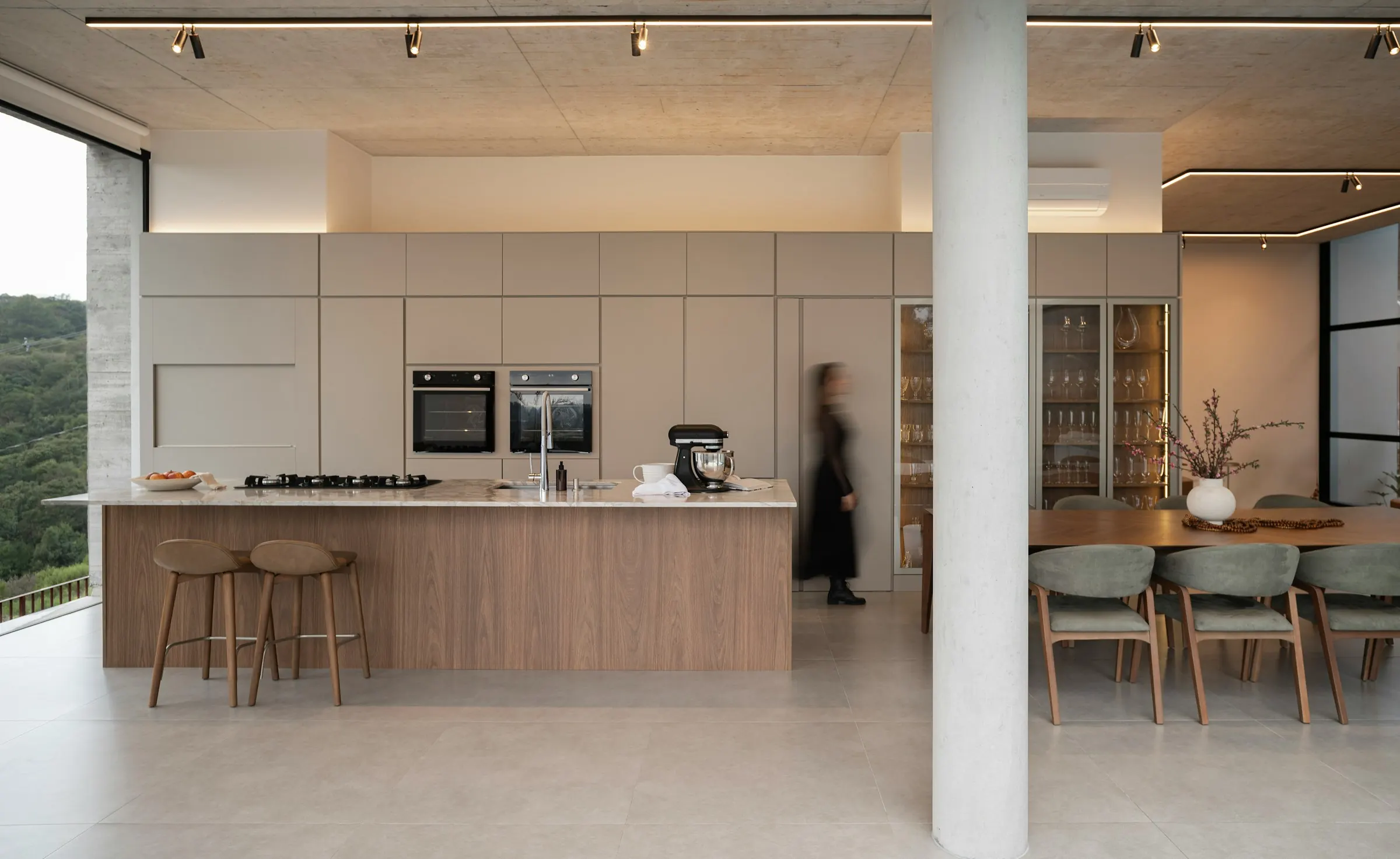Contemporary kitchen with warm timber island, full-height cabinetry and an adjoining dining space — Ardo Carpentry inspiration